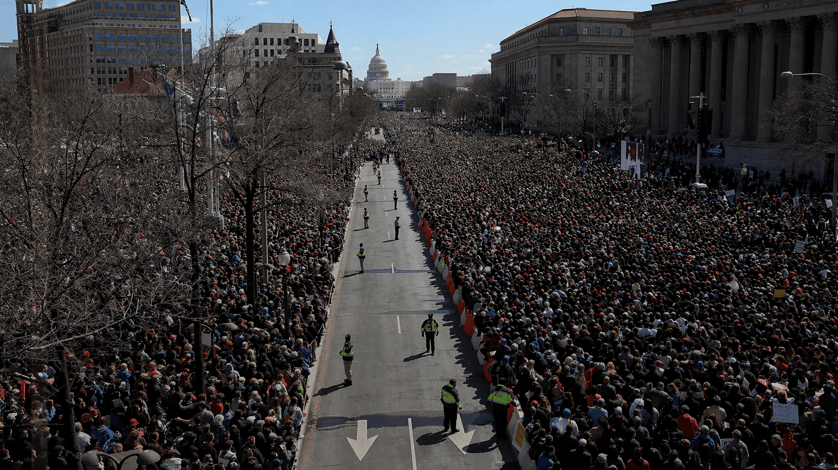 An enormous crowd filling a Washington, D.C. avenue toward the U.S. Capitol